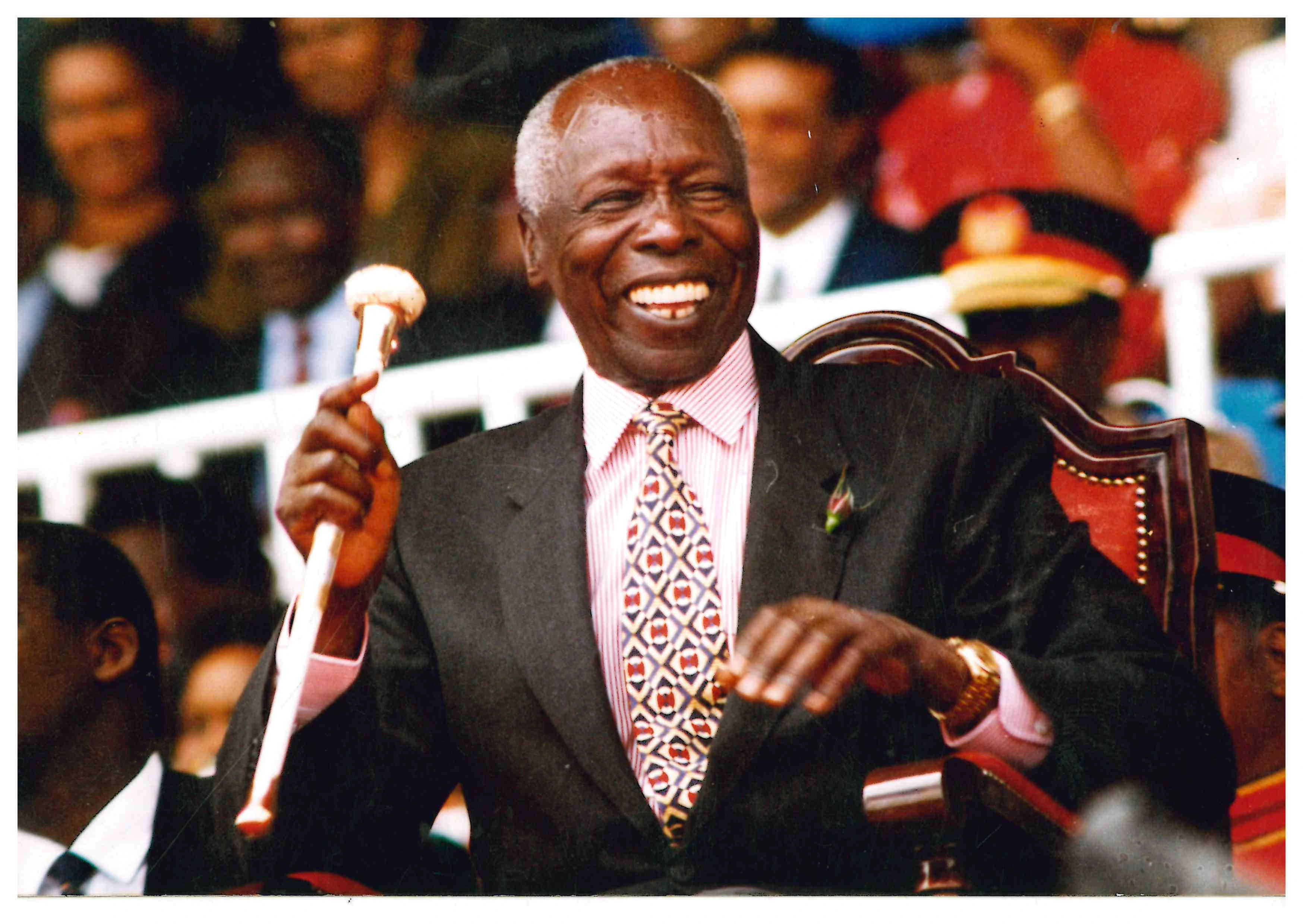 President Daniel Arap Moi laughing during Madaraka Day Celebrations at Nyayo Stadium