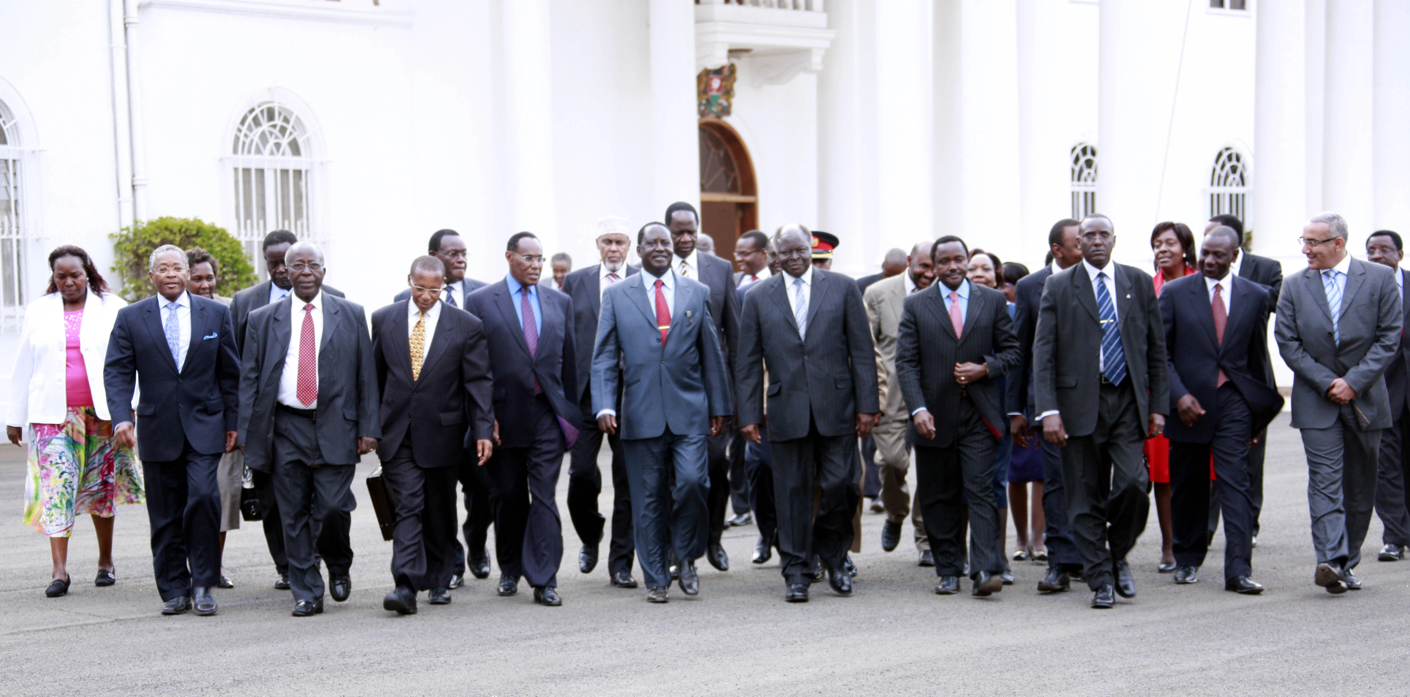 President Mwai Kibaki walking together with the Grand Coalition Cabinet Ministers at State House Nairobi
