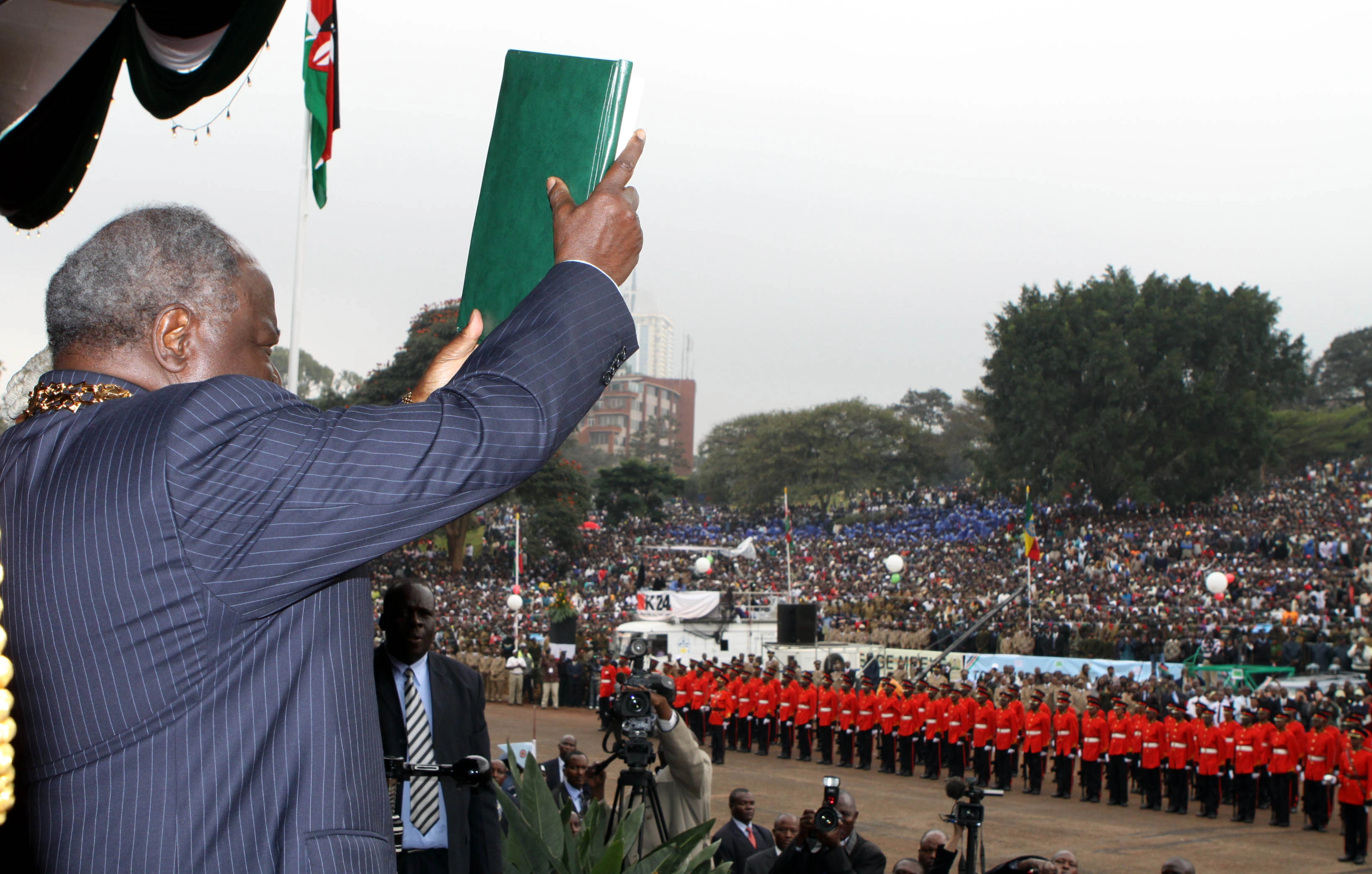 President Mwai Kibaki waving the New Constitution on Promulgation Day at Uhuru Park Nairobi 1