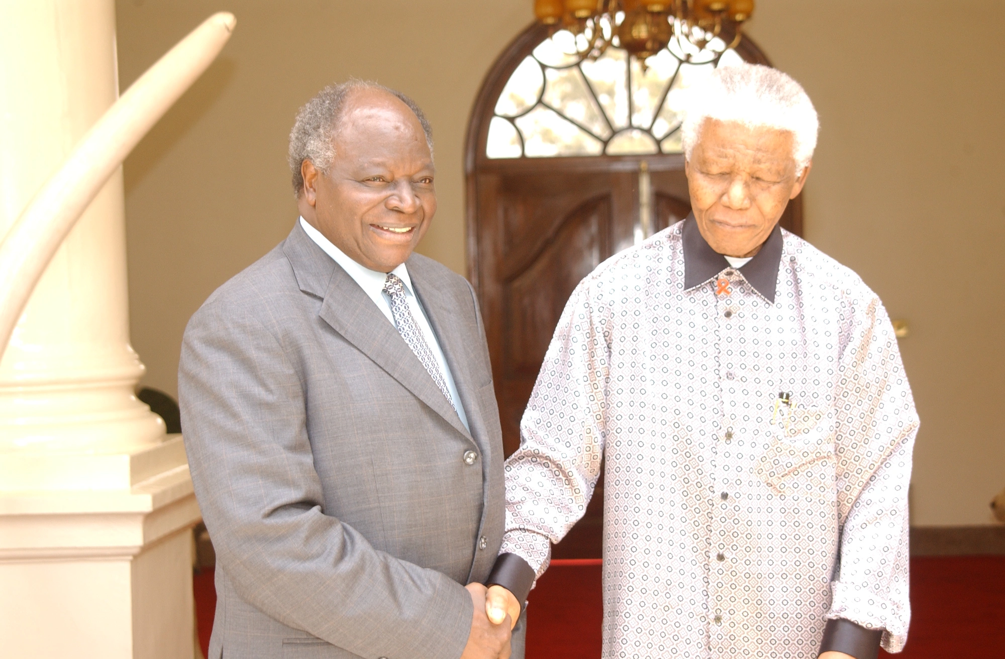 President Mwai Kibaki welcoming Former South African President Nelson Mandela Senator at State House Nairobi
