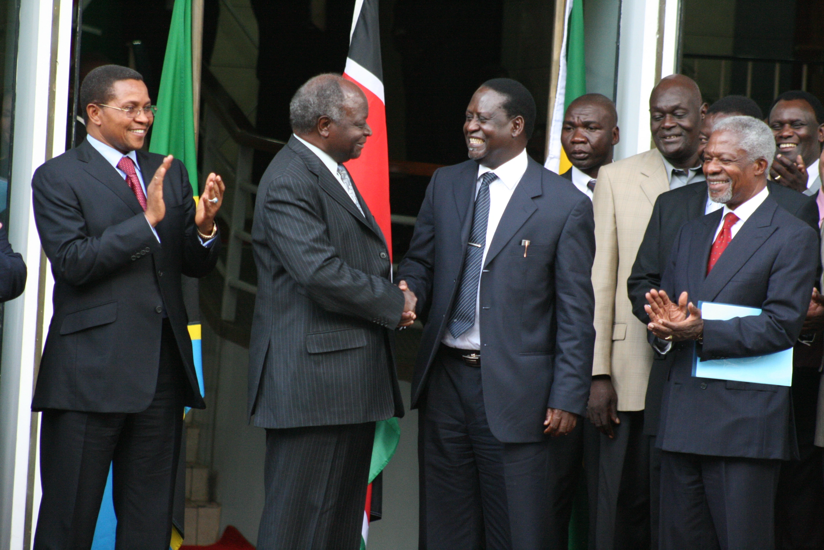 President Mwai Kibaki and opposition leader Raila Odinga handshake after signing the Power Sharing Deal at Harambee House Nairobi 28.2.2008.