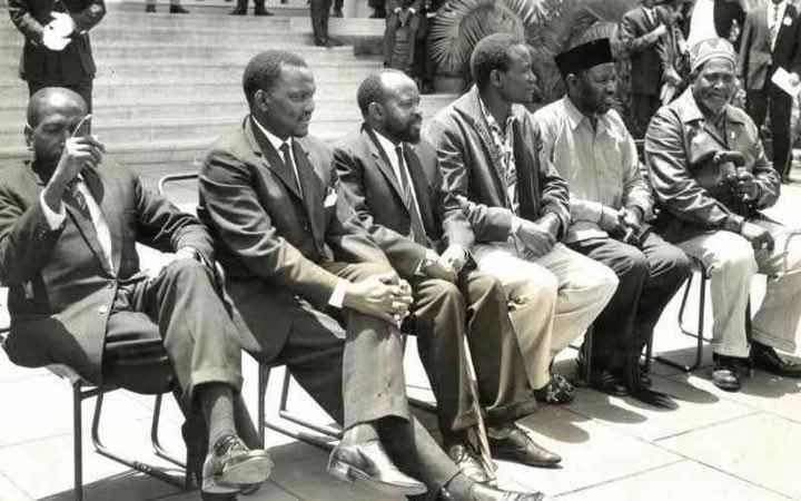 Kapenguria six former prisoners (from left to right) Kungu Karumba, Paul Ngei, Bildad Kaggia, Achieng Oneko, Fred Kubai and Jomo Kenyatta.webp