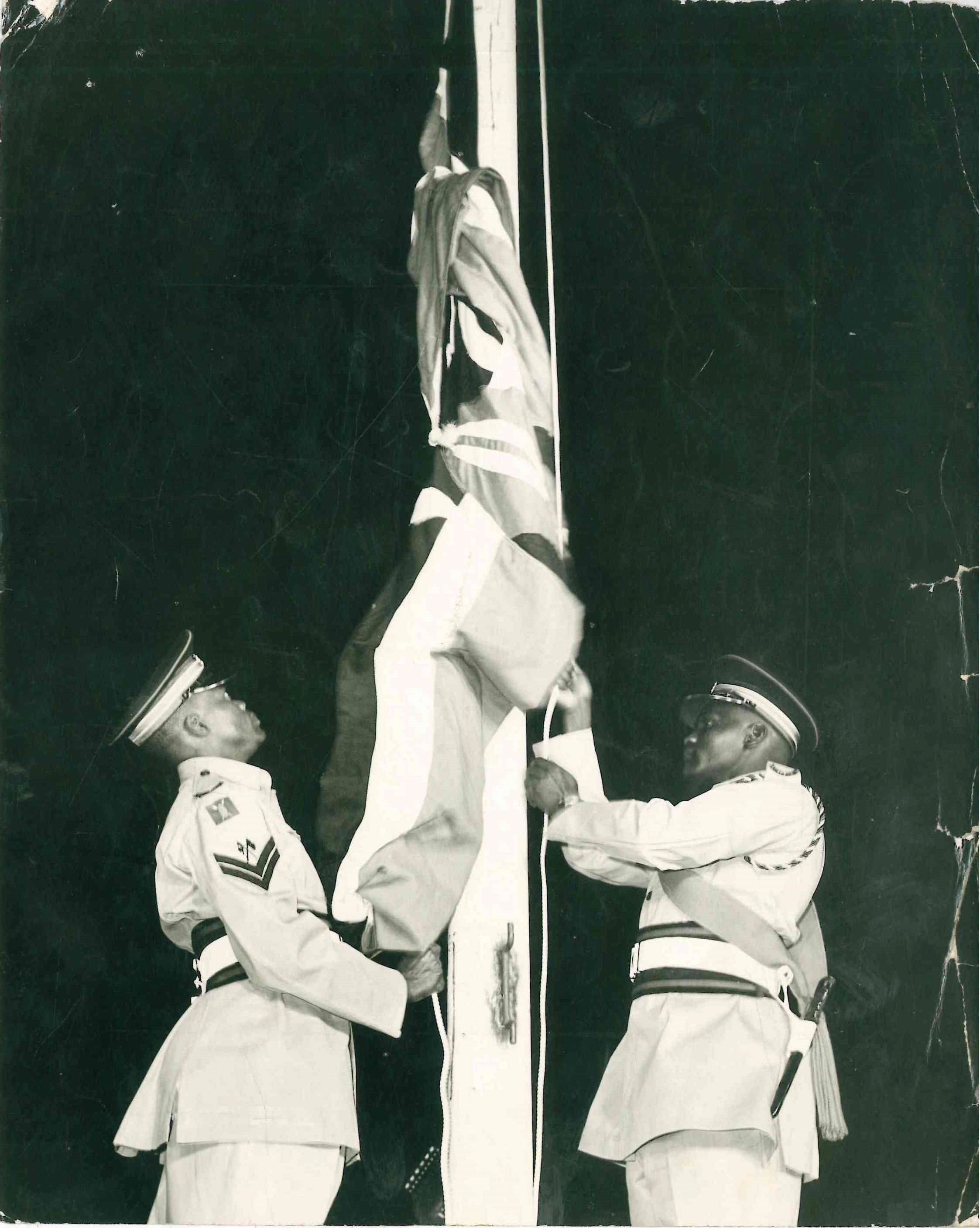 Kenya Military Officers hoisting The Kenyan NATIONAL FLAG and lowering the UNION JACK during Independence Celebrations