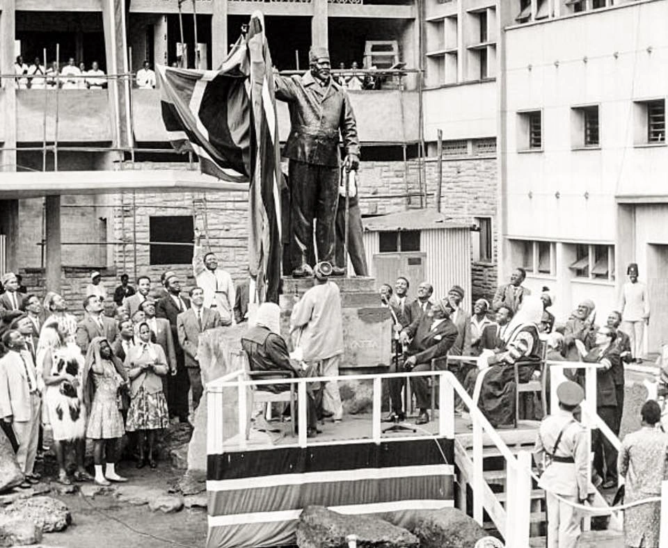 Independence celebrations, December 12, 1963_Mzee Jomo Kenyatta and other dignitaries look on as Oginga Odinga unveils the statue of the former at Parliament Bldgs