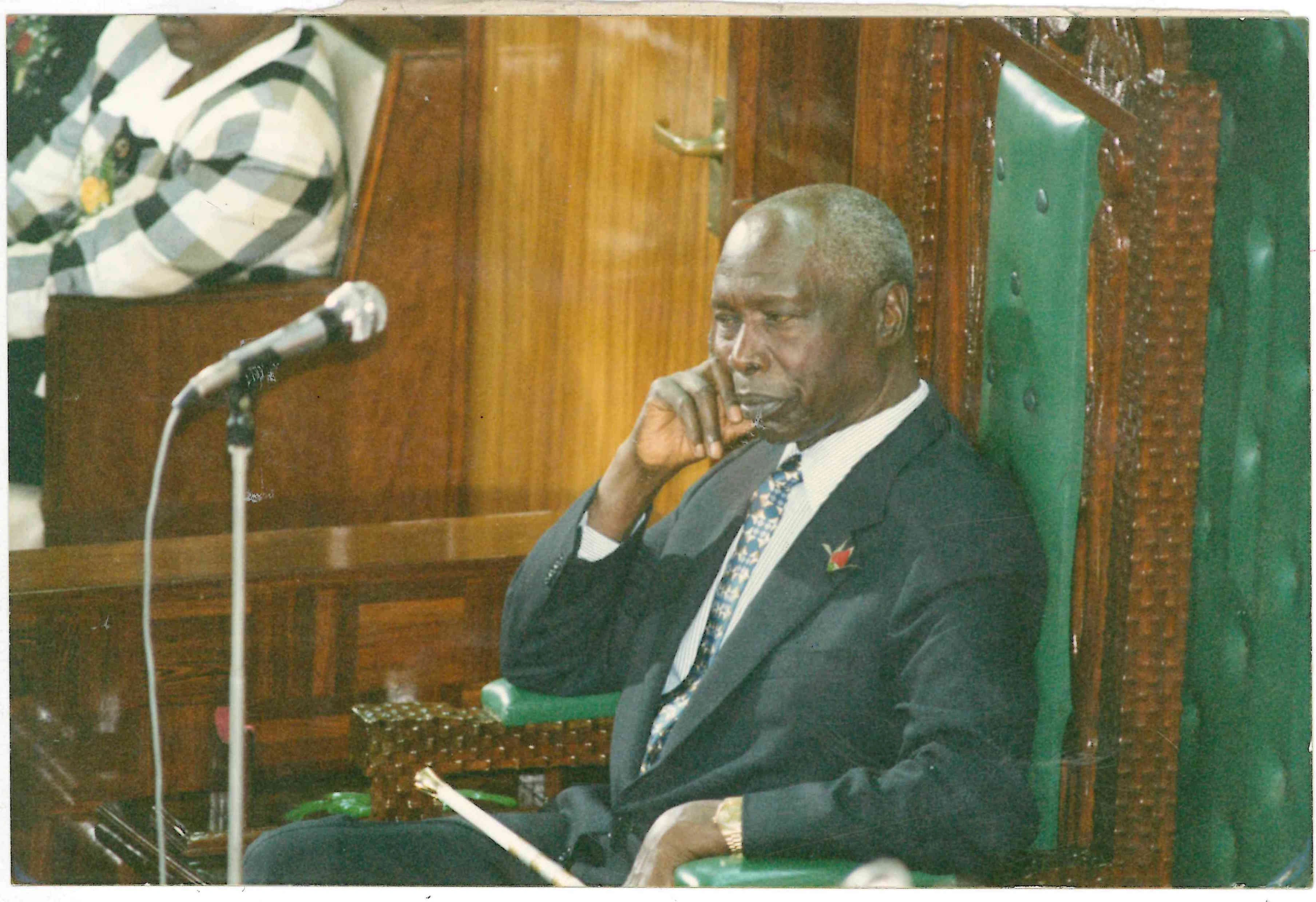 President Daniel Arap Moi and Baringo Central MP listening to the Budget speech presented by Finance Minister Simeon Nyachae at Parliament Buildings
