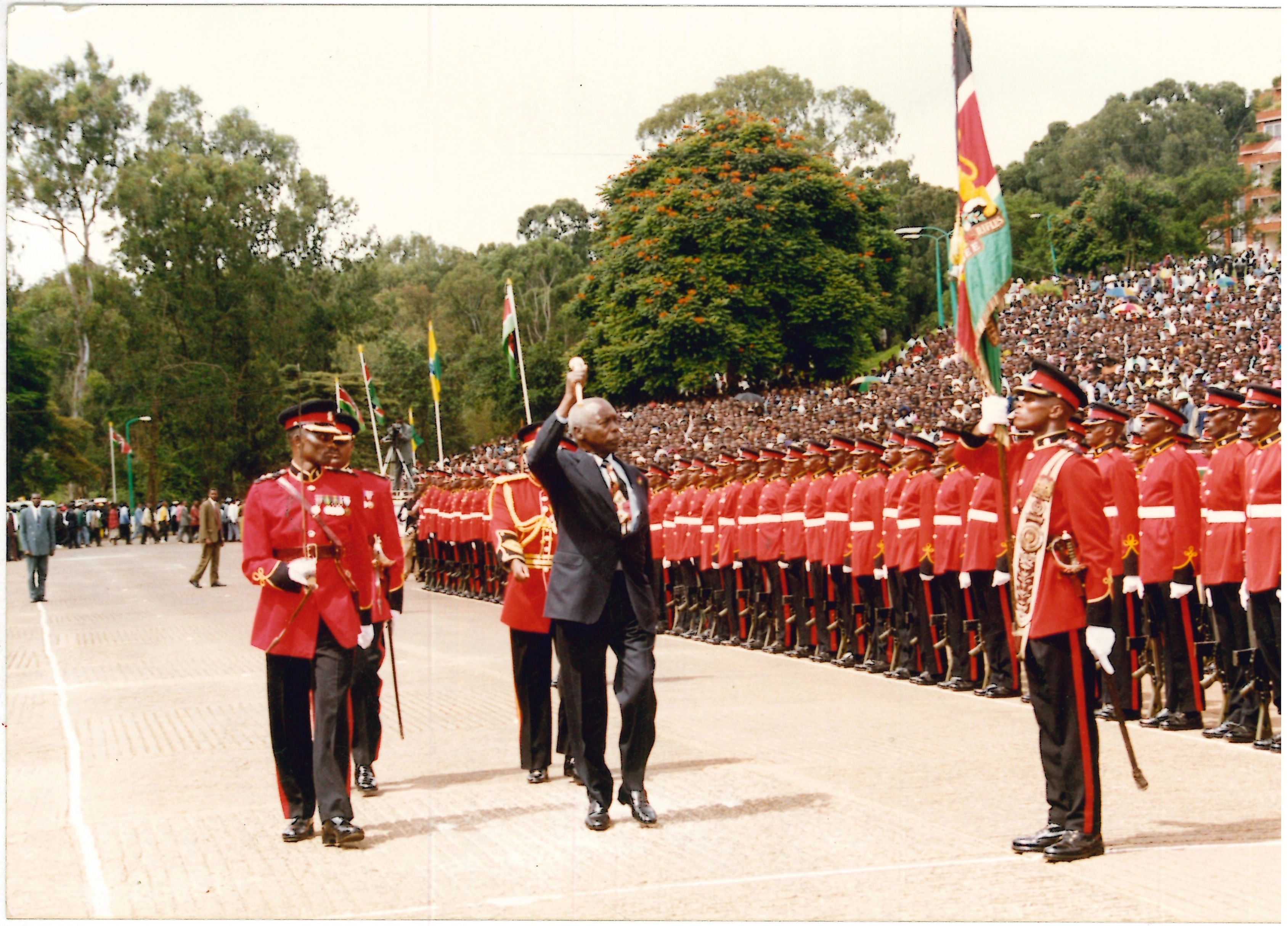 President Daniel Arap Moi salutes the Kenya Armed Forces flag