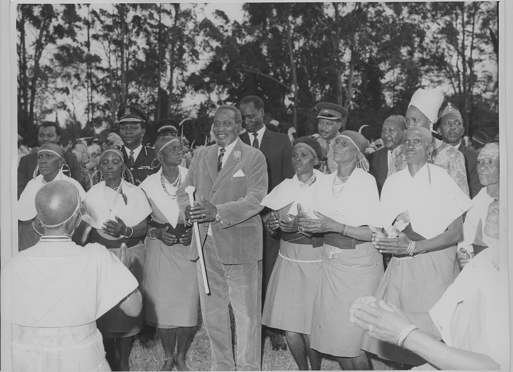 President Jomo Kenyatta being entertained by traditional dancers at State House Nairobi