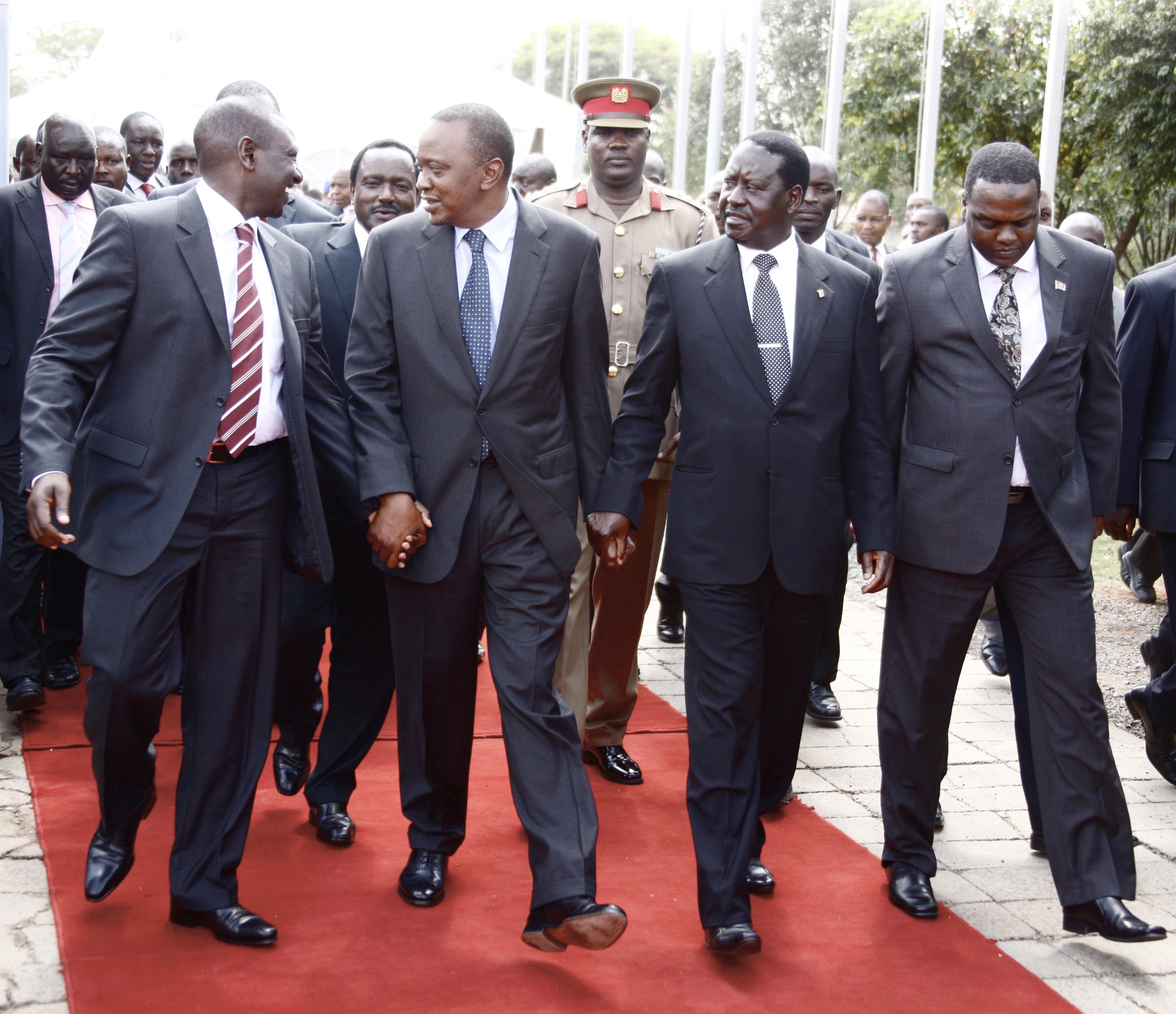 President Uhuru Kenyatta holding hands with Deputy President William Ruto and ODM leader Raila Odinga in Nairobi