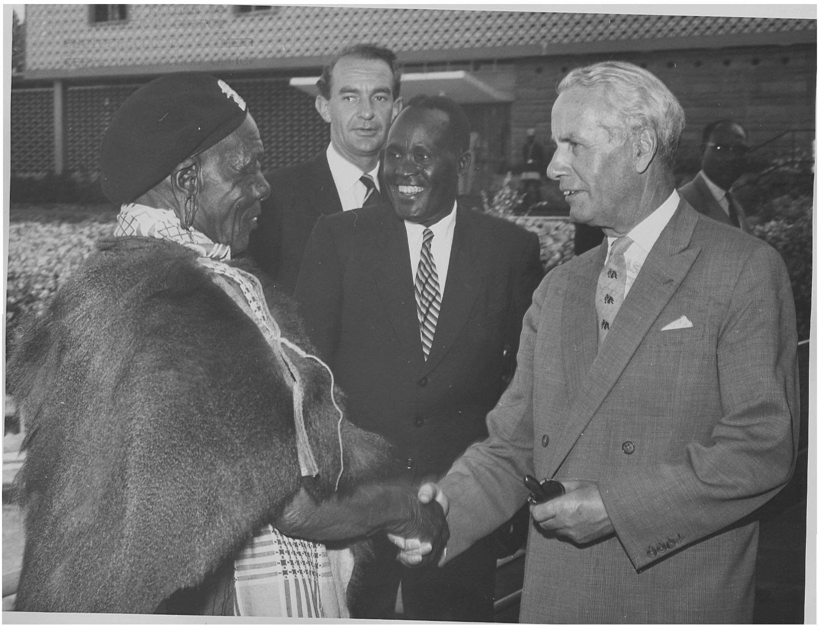 Release of Kenyatta & Countdown to Independence_Governor of Kenya Sir Malcolm MacDonald  pictured shaking hands with Njiri in Nyeri_1st Feb 1963